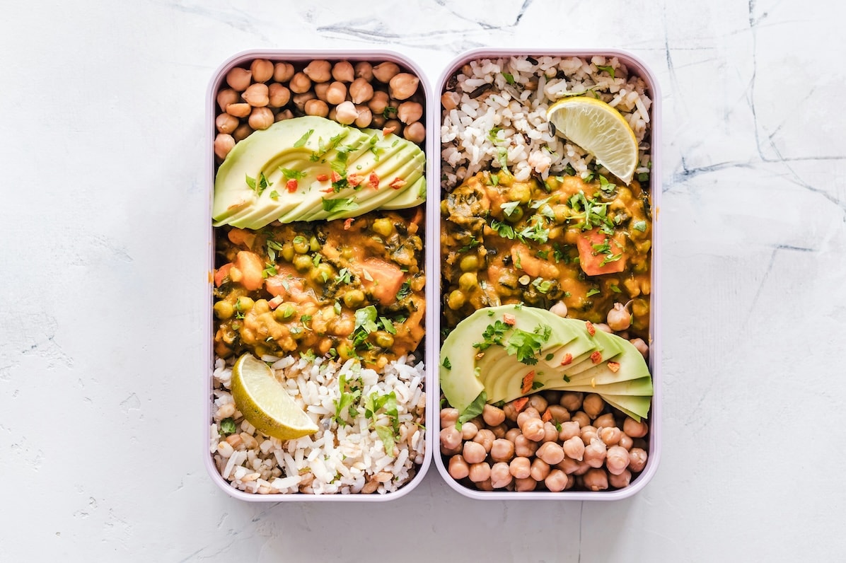 A private chef prepping a week of meals in a home kitchen