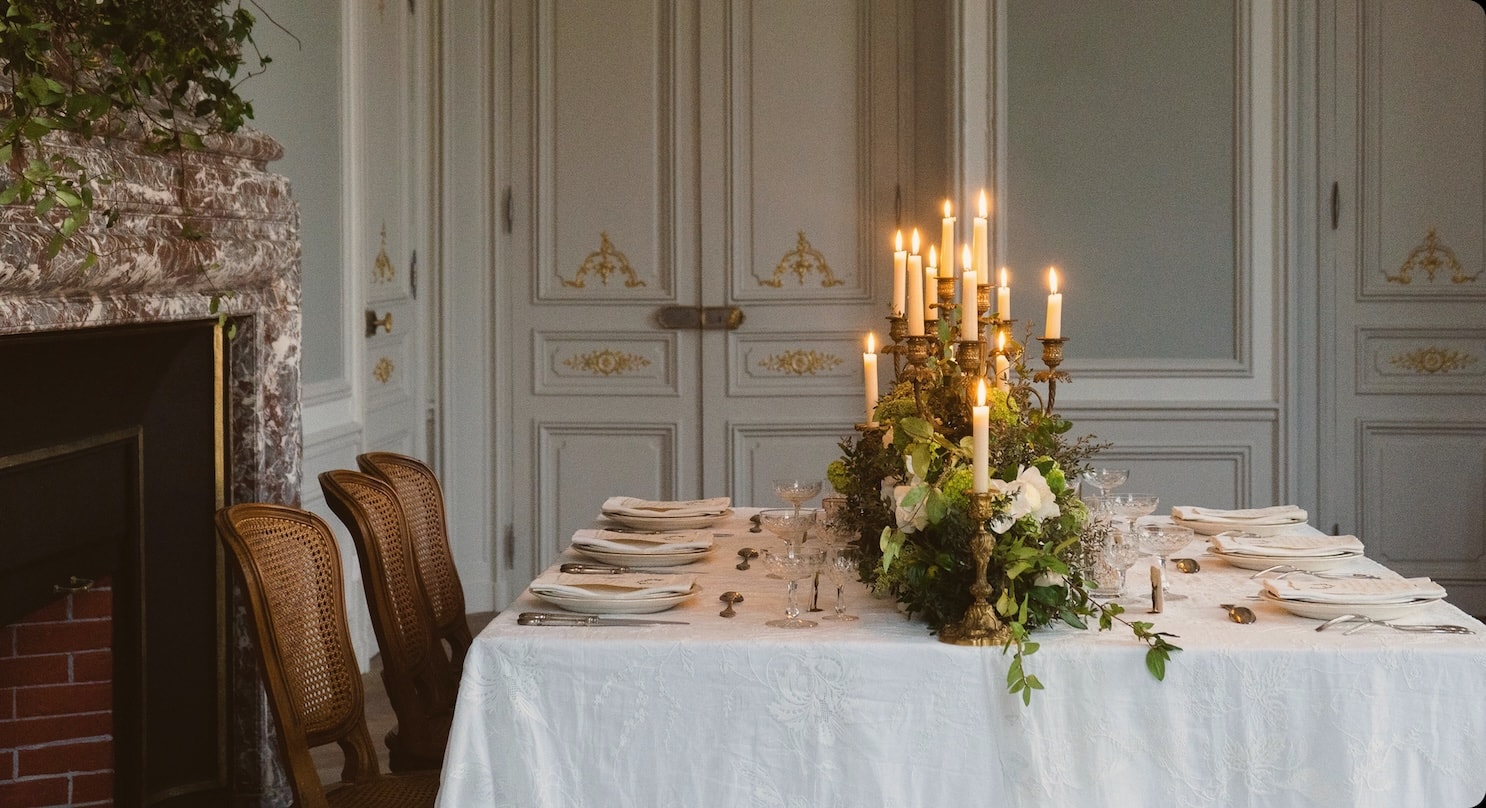 Private dining table set in a classic Parisian apartment with high ceilings