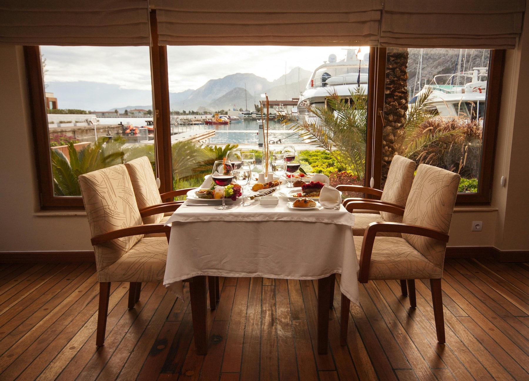A dinner table set for 8 persons on the Lake Geneva